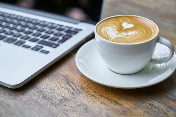 coffee with a book and a laptop